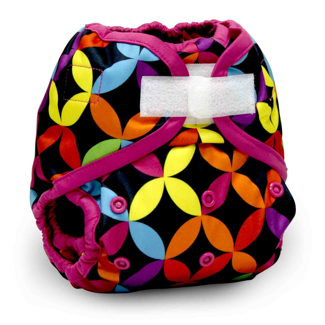 Colorful patterned diaper with a white bow on a white background