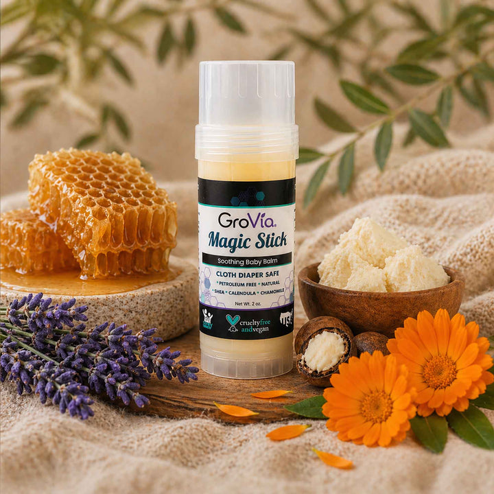 GroVia Magic Stick with honeycomb, lavender, and flowers on a natural background