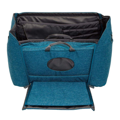 The inside of the Hie Diaper Bag in the color Bay. Showing the lid open and the changing pod. 